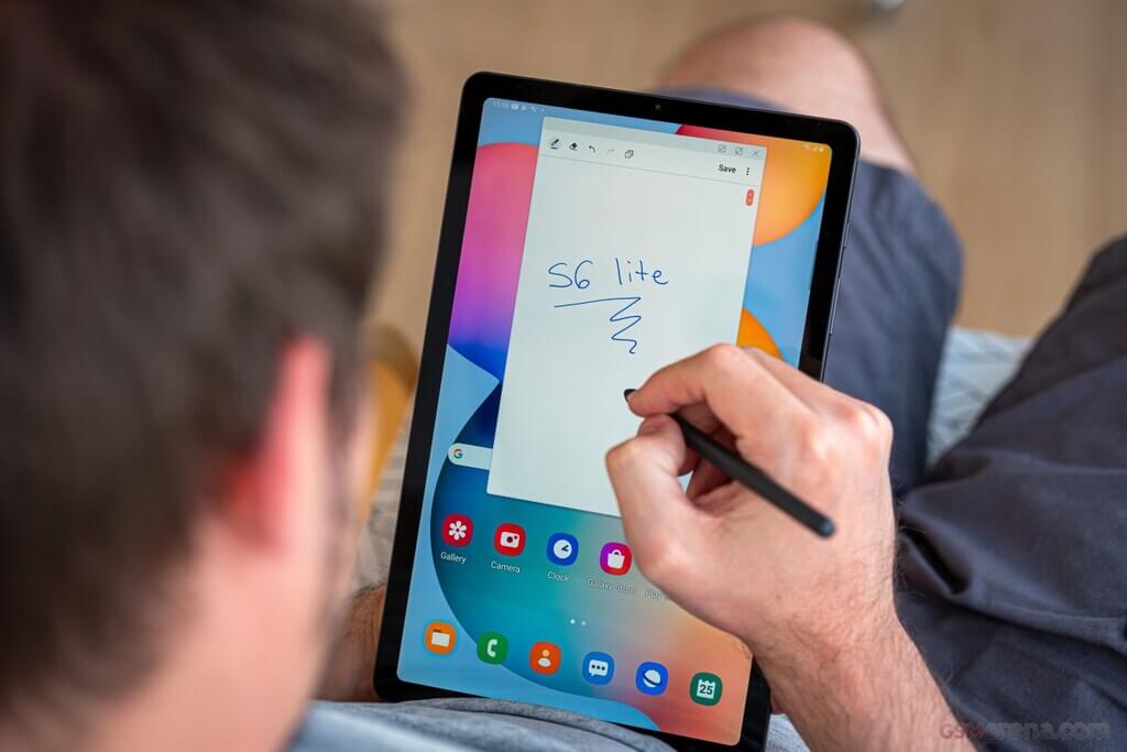 A person is using the S Pen to write on a Samsung Galaxy Tab S6 Lite, which is a tablet that costs under 3 million.